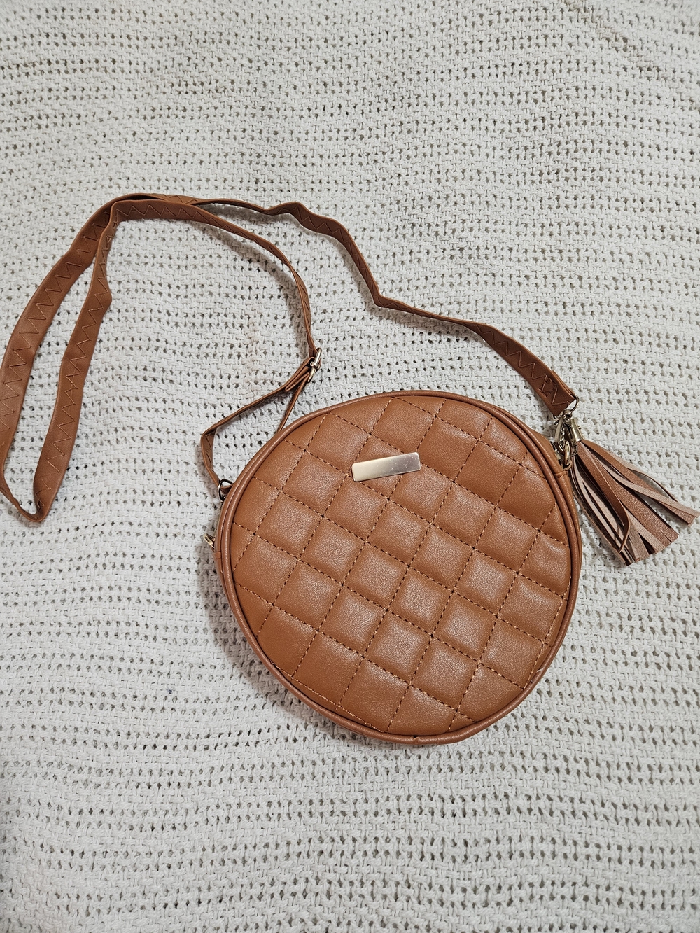 Quilted Round Crossbody Bag with Tassel in Tan